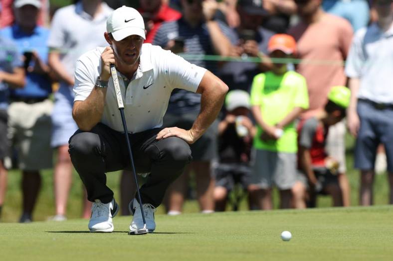 Jun 26, 2022; Cromwell, Connecticut, USA; Rory McIlroy looks over a putt on the fourth green during the final round of the Travelers Championship golf tournament. Mandatory Credit: Vincent Carchietta-USA TODAY Sports