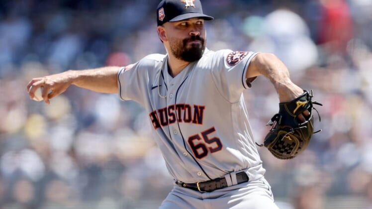 Jun 26, 2022; Bronx, New York, USA; Houston Astros starting pitcher Jose Urquidy (65) pitches against the New York Yankees during the first inning at Yankee Stadium. Mandatory Credit: Brad Penner-USA TODAY Sports