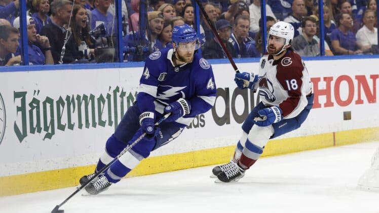 Jun 22, 2022; Tampa, Florida, USA; Tampa Bay Lightning defenseman Jan Rutta (44) skates with the puck as Colorado Avalanche center Alex Newhook (18) chases in game four of the 2022 Stanley Cup Final at Amalie Arena. Mandatory Credit: Geoff Burke-USA TODAY Sports