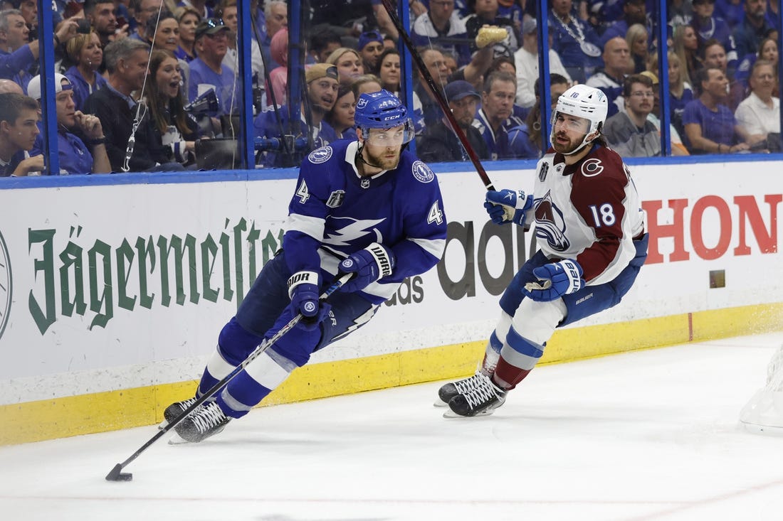 Jun 22, 2022; Tampa, Florida, USA; Tampa Bay Lightning defenseman Jan Rutta (44) skates with the puck as Colorado Avalanche center Alex Newhook (18) chases in game four of the 2022 Stanley Cup Final at Amalie Arena. Mandatory Credit: Geoff Burke-USA TODAY Sports
