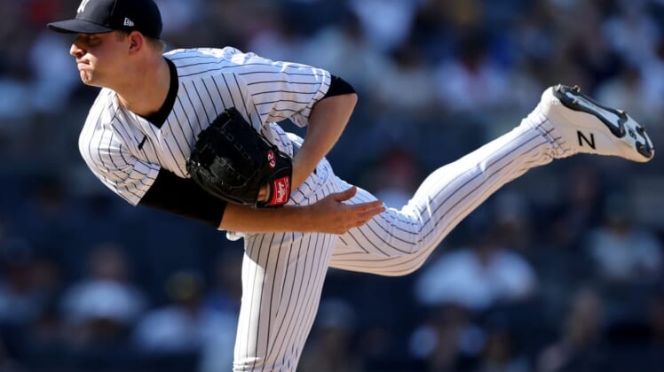 Jun 26, 2022; Bronx, New York, USA; New York Yankees starting pitcher Michael King (34) follows through on a pitch against the Houston Astros during the tenth inning at Yankee Stadium. Mandatory Credit: Brad Penner-USA TODAY Sports
