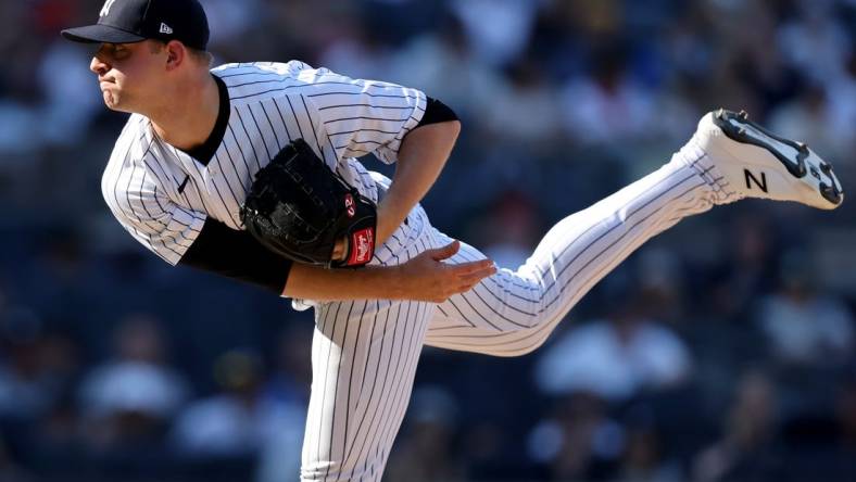 Jun 26, 2022; Bronx, New York, USA; New York Yankees starting pitcher Michael King (34) follows through on a pitch against the Houston Astros during the tenth inning at Yankee Stadium. Mandatory Credit: Brad Penner-USA TODAY Sports