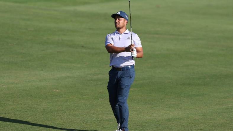 Jun 26, 2022; Cromwell, Connecticut, USA; Xander Schauffele plays a shot from the fairway of the 18th hole during the final round of the Travelers Championship golf tournament. Mandatory Credit: Vincent Carchietta-USA TODAY Sports