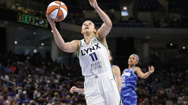 Jun 26, 2022; Chicago, Illinois, USA; Minnesota Lynx forward Natalie Achonwa (11) goes to the basket against the Chicago Sky during the second half of a WNBA game at Wintrust Arena. Mandatory Credit: Kamil Krzaczynski-USA TODAY Sports