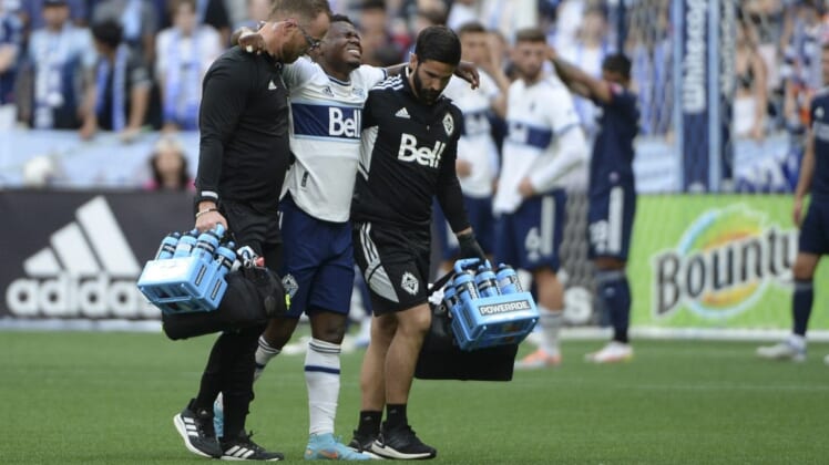 Jun 26, 2022; Vancouver, British Columbia, CAN;  Vancouver Whitecaps forward Deiber Caicedo (7) is taken off the field during the first half against the New England Revolution at BC Place. Mandatory Credit: Anne-Marie Sorvin-USA TODAY Sports