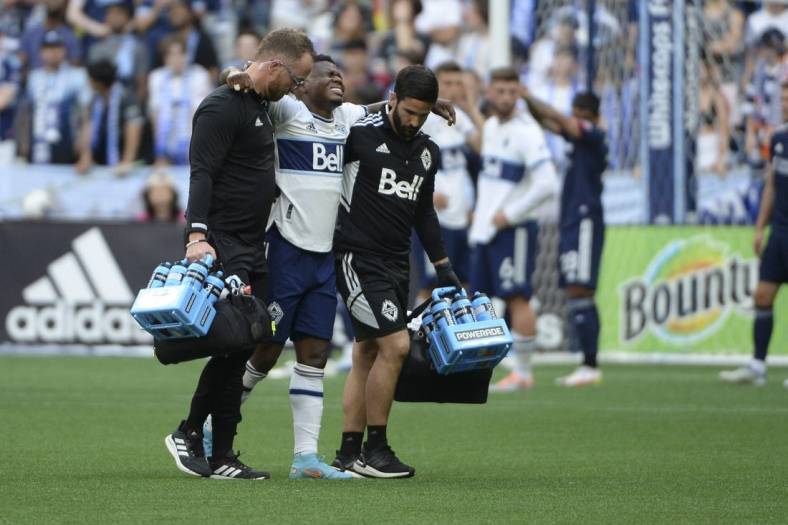 Jun 26, 2022; Vancouver, British Columbia, CAN;  Vancouver Whitecaps forward Deiber Caicedo (7) is taken off the field during the first half against the New England Revolution at BC Place. Mandatory Credit: Anne-Marie Sorvin-USA TODAY Sports