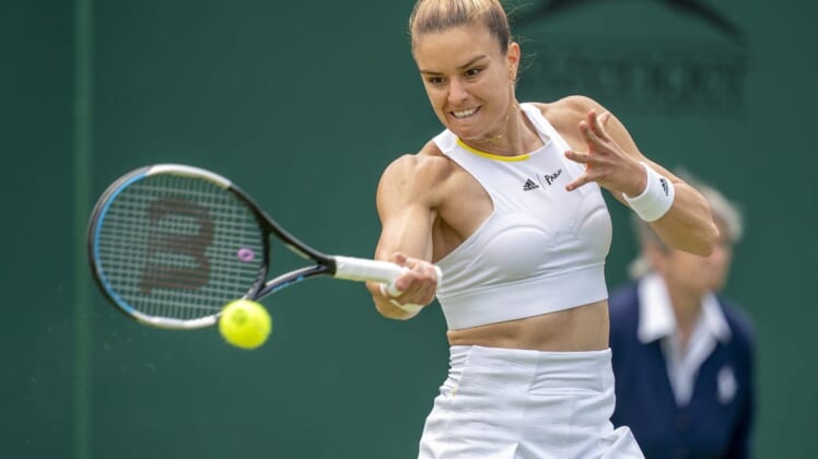 Jun 28, 2022; London, United Kingdom; Maria Sakkari (GRE) returns a shot during her first round match against Zoe Hives (AUS) on day two at All England Lawn Tennis and Croquet Club. Mandatory Credit: Susan Mullane-USA TODAY Sports