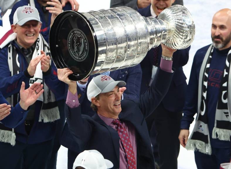 Jun 26, 2022; Tampa, Florida, USA; Colorado Avalanche general manager Joe Sakic celebrates with the Stanley Cup trophy after defeating the Tampa Bay Lightning during game six of the 2022 Stanley Cup Final at Amalie Arena. Mandatory Credit: Mark J. Rebilas-USA TODAY Sports