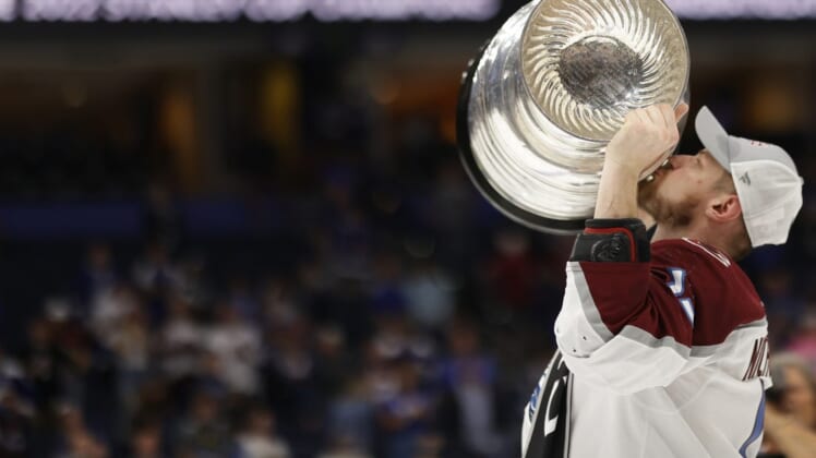 Jun 26, 2022; Tampa, Florida, USA; Colorado Avalanche right wing Valeri Nichushkin (13) celebrates by kissing the Stanley Cup after the Avalanche game against the Tampa Bay Lightning in game six of the 2022 Stanley Cup Final at Amalie Arena. Mandatory Credit: Geoff Burke-USA TODAY Sports