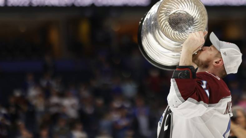 Jun 26, 2022; Tampa, Florida, USA; Colorado Avalanche right wing Valeri Nichushkin (13) celebrates by kissing the Stanley Cup after the Avalanche game against the Tampa Bay Lightning in game six of the 2022 Stanley Cup Final at Amalie Arena. Mandatory Credit: Geoff Burke-USA TODAY Sports