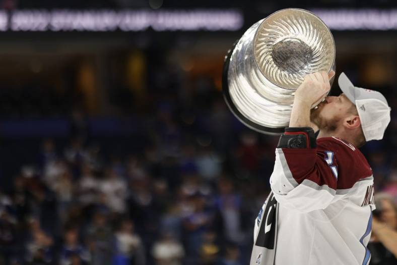 Jun 26, 2022; Tampa, Florida, USA; Colorado Avalanche right wing Valeri Nichushkin (13) celebrates by kissing the Stanley Cup after the Avalanche game against the Tampa Bay Lightning in game six of the 2022 Stanley Cup Final at Amalie Arena. Mandatory Credit: Geoff Burke-USA TODAY Sports