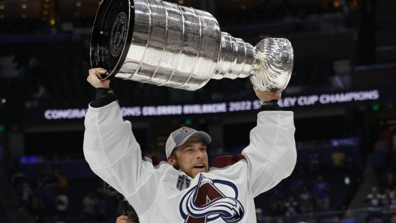 Jun 26, 2022; Tampa, Florida, USA; Colorado Avalanche goaltender Darcy Kuemper (35) celebrates with the Stanley Cup after the Avalanche game against the Tampa Bay Lightning in game six of the 2022 Stanley Cup Final at Amalie Arena. Mandatory Credit: Geoff Burke-USA TODAY Sports