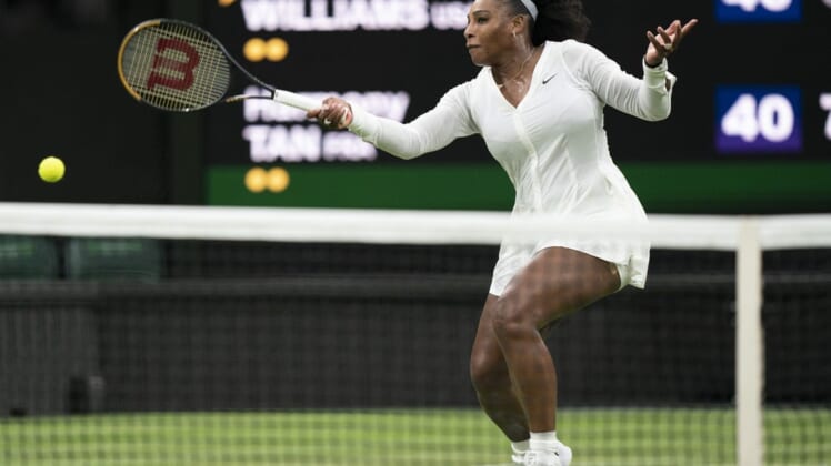 Jun 28, 2022; London, United Kingdom; Serena Williams (USA) returns a shot during her first round match against Harmony Tan (FRA) on day two at All England Lawn Tennis and Croquet Club. Mandatory Credit: Susan Mullane-USA TODAY Sports