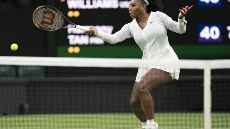 Jun 28, 2022; London, United Kingdom; Serena Williams (USA) returns a shot during her first round match against Harmony Tan (FRA) on day two at All England Lawn Tennis and Croquet Club. Mandatory Credit: Susan Mullane-USA TODAY Sports