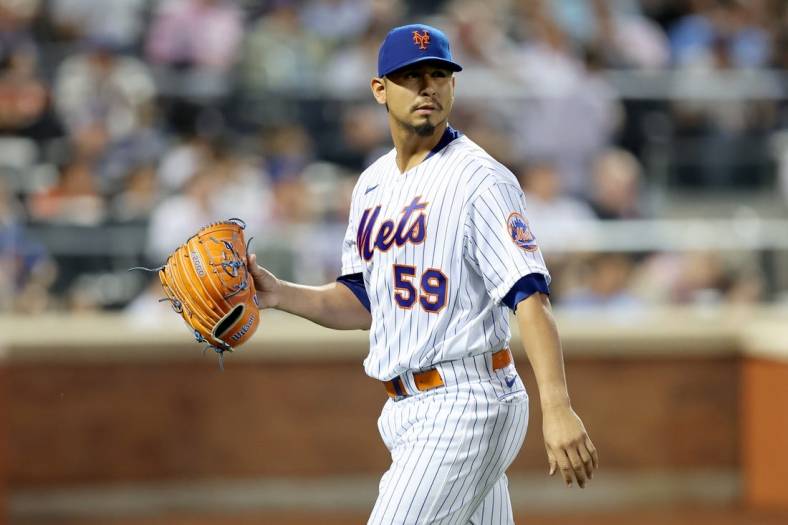 Jun 28, 2022; New York City, New York, USA; New York Mets starting pitcher Carlos Carrasco (59) walks off the field after being taken out of the game against the Houston Astros during the fifth inning at Citi Field. Mandatory Credit: Brad Penner-USA TODAY Sports