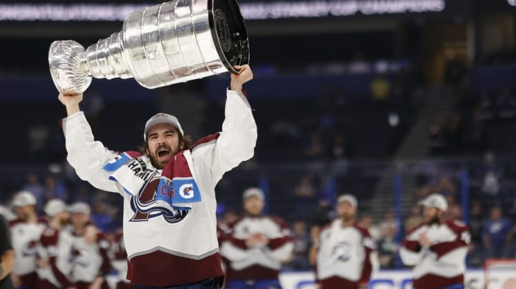 Jun 26, 2022; Tampa, Florida, USA; Colorado Avalanche center Alex Newhook (18) celebrates with the Stanley Cup after the Avalanche game against the Tampa Bay Lightning in game six of the 2022 Stanley Cup Final at Amalie Arena. Mandatory Credit: Geoff Burke-USA TODAY Sports