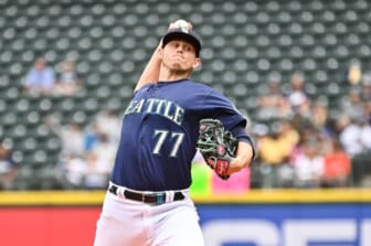 Jun 29, 2022; Seattle, Washington, USA; Seattle Mariners starting pitcher Chris Flexen (77) pitches to the Baltimore Orioles during the first inning at T-Mobile Park. Mandatory Credit: Steven Bisig-USA TODAY Sports