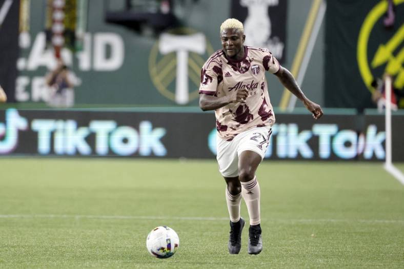 Jun 29, 2022; Portland, Oregon, USA; Portland Timbers forward Dairon Asprilla (27) carries the ball during the second half against the Houston Dynamo at Providence Park. Mandatory Credit: Soobum Im-USA TODAY Sports