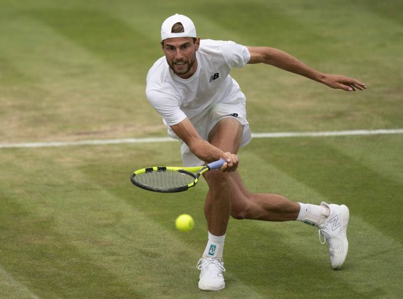 Jul 1, 2022; London, United Kingdom; Maxime Cressy (USA) returns a shot during his match against Jack Sock (USA) on day five at All England Lawn Tennis and Croquet Club. Mandatory Credit: Susan Mullane-USA TODAY Sports