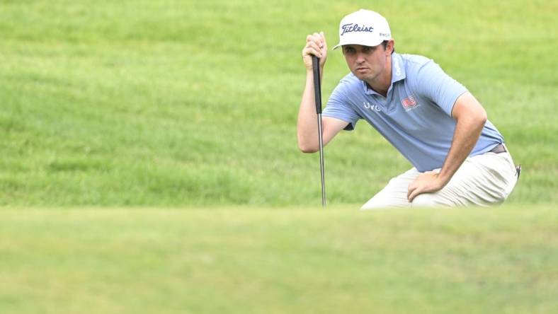 Jul 1, 2022; Silvis, Illinois, USA; J.T. Poston lines up a putt on the 1st hole during the second round of the John Deere Classic golf tournament. Mandatory Credit: Marc Lebryk-USA TODAY Sports