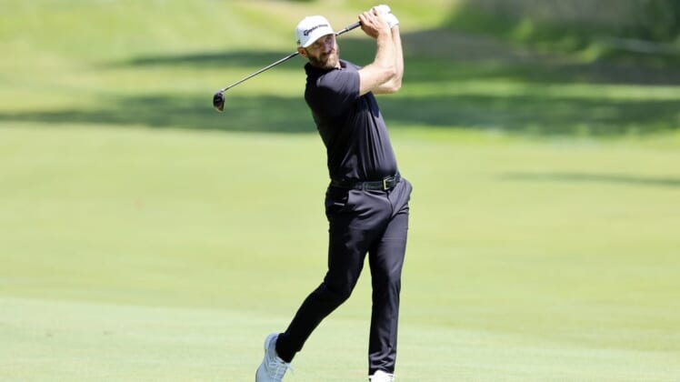 Jul 1, 2022; Portland, Oregon, USA; Dustin Johnson hits from the fairway on the fifth hole during the second round of the LIV Golf tournament at Pumpkin Ridge Golf Club. Mandatory Credit: Soobum Im-USA TODAY Sports