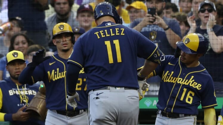Jul 1, 2022; Pittsburgh, Pennsylvania, USA;  Milwaukee Brewers shortstop Willy Adames (27) and second baseman Kolten Wong (16) congratulate first baseman Rowdy Tellez (11) on his three run home run against the Pittsburgh Pirates during the second inning at PNC Park. Mandatory Credit: Charles LeClaire-USA TODAY Sports