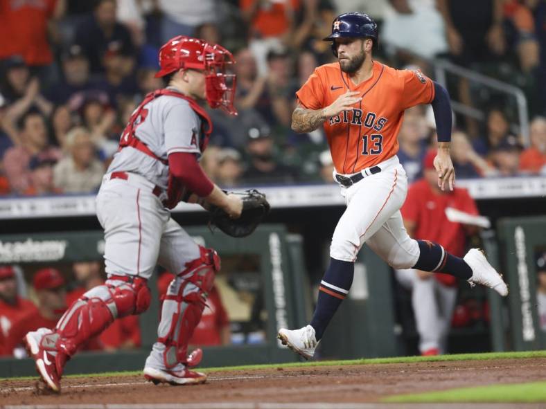 Jul 1, 2022; Houston, Texas, USA; Houston Astros designated hitter J.J. Matijevic (13) scores against the Los Angeles Angels in the third inning at Minute Maid Park. Mandatory Credit: Thomas Shea-USA TODAY Sports