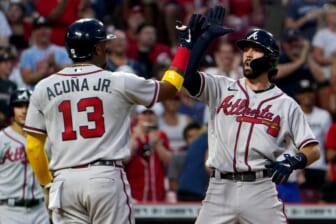 Atlanta Braves shortstop Dansby Swanson (7), right, is congratulated by Atlanta Braves designated hitter Ronald Acuna Jr. (13), left, after hitting three-run home run during the seventh inning of a baseball game against the Cincinnati Reds, Friday, July 1, 2022, at Great American Ball Park in Cincinnati. The Atlanta Braves won, 9-1.Atlanta Braves At Cincinnati Reds July 1 0036