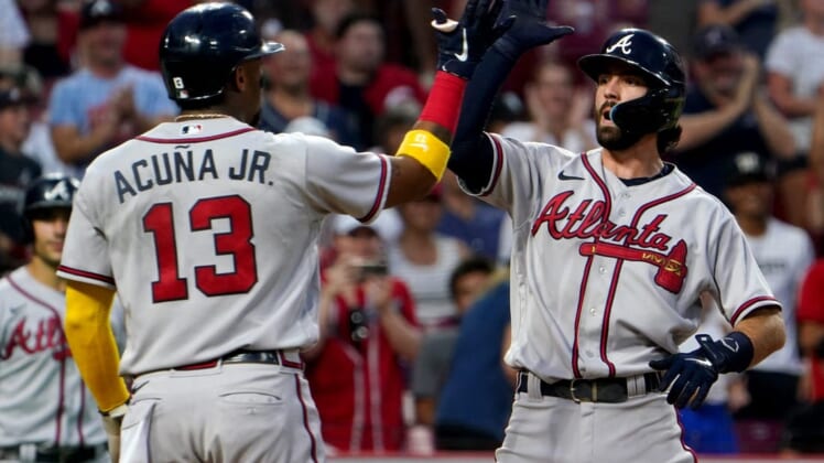 Atlanta Braves shortstop Dansby Swanson (7), right, is congratulated by Atlanta Braves designated hitter Ronald Acuna Jr. (13), left, after hitting three-run home run during the seventh inning of a baseball game against the Cincinnati Reds, Friday, July 1, 2022, at Great American Ball Park in Cincinnati. The Atlanta Braves won, 9-1.Atlanta Braves At Cincinnati Reds July 1 0036