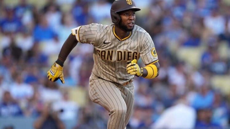 Jul 1, 2022; Los Angeles, California, USA; San Diego Padres left fielder Jurickson Profar (10) runs toward first base on a double in the first inning against the Los Angeles Dodgers at Dodger Stadium. Mandatory Credit: Kirby Lee-USA TODAY Sports