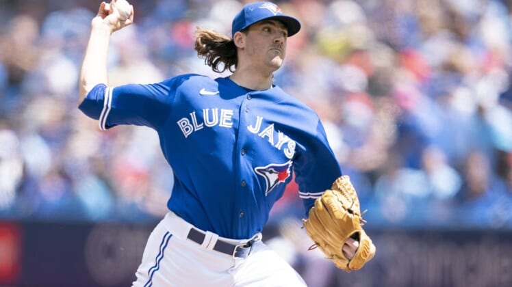 Jul 2, 2022; Toronto, Ontario, CAN; Toronto Blue Jays starting pitcher Kevin Gausman (34) throws a pitch against the Tampa Bay Rays during the first inning at Rogers Centre. Mandatory Credit: Nick Turchiaro-USA TODAY Sports