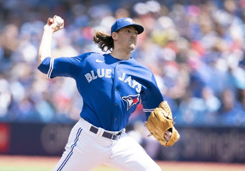 Jul 2, 2022; Toronto, Ontario, CAN; Toronto Blue Jays starting pitcher Kevin Gausman (34) throws a pitch against the Tampa Bay Rays during the first inning at Rogers Centre. Mandatory Credit: Nick Turchiaro-USA TODAY Sports