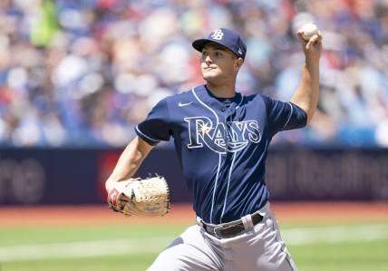 Jul 2, 2022; Toronto, Ontario, CAN; Tampa Bay Rays starting pitcher Shane McClanahan (18) throws a pitch against the Toronto Blue Jays during the first inning at Rogers Centre. Mandatory Credit: Nick Turchiaro-USA TODAY Sports