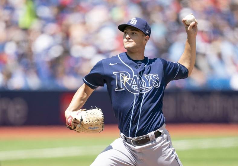 Jul 2, 2022; Toronto, Ontario, CAN; Tampa Bay Rays starting pitcher Shane McClanahan (18) throws a pitch against the Toronto Blue Jays during the first inning at Rogers Centre. Mandatory Credit: Nick Turchiaro-USA TODAY Sports