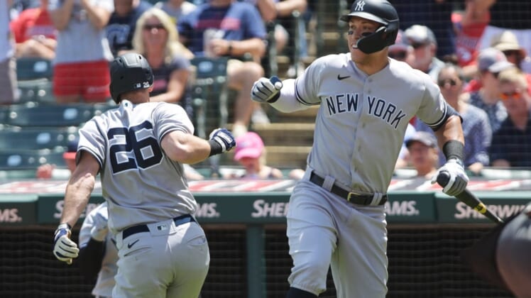 Jul 2, 2022; Cleveland, Ohio, USA; New York Yankees third baseman DJ LeMahieu (26) celebrates with designated hitter Aaron Judge (99) after hitting a home run during the third inning against the Cleveland Guardians at Progressive Field. Mandatory Credit: Ken Blaze-USA TODAY Sports