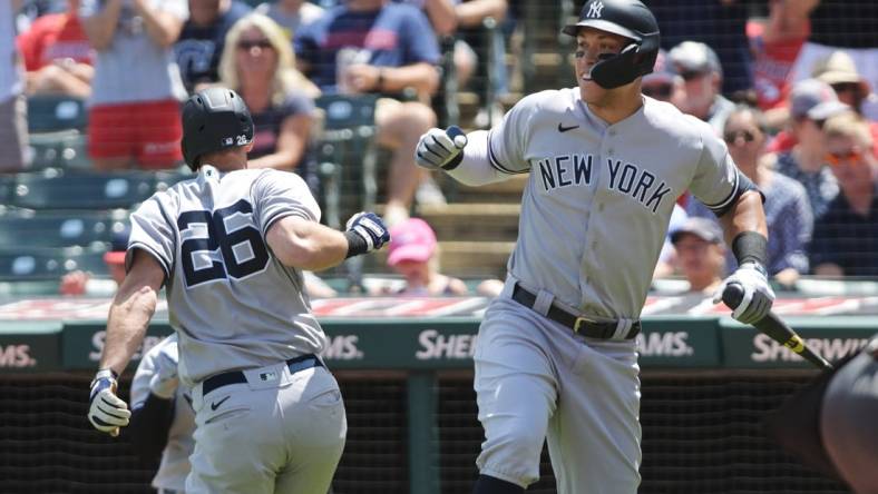 Jul 2, 2022; Cleveland, Ohio, USA; New York Yankees third baseman DJ LeMahieu (26) celebrates with designated hitter Aaron Judge (99) after hitting a home run during the third inning against the Cleveland Guardians at Progressive Field. Mandatory Credit: Ken Blaze-USA TODAY Sports