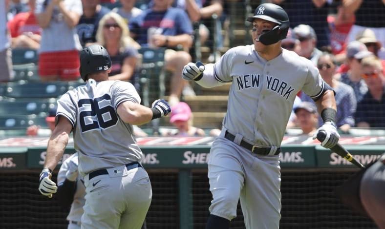 Jul 2, 2022; Cleveland, Ohio, USA; New York Yankees third baseman DJ LeMahieu (26) celebrates with designated hitter Aaron Judge (99) after hitting a home run during the third inning against the Cleveland Guardians at Progressive Field. Mandatory Credit: Ken Blaze-USA TODAY Sports