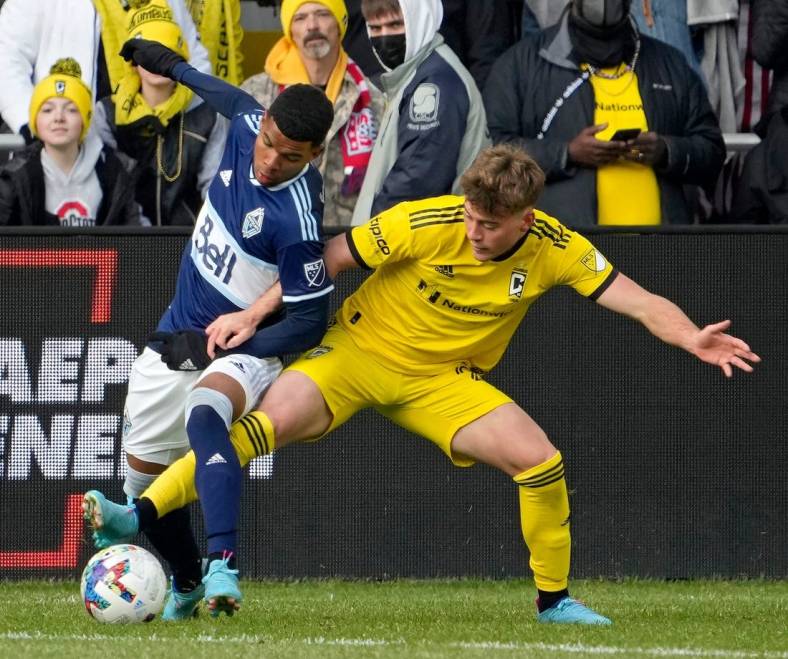 Vancouver Whitecaps midfielder Pedro Vite (45) and Columbus Crew midfielder Aidan Morris (21) compete for a ball during the second half of Saturday's season opener at Lower.com field in Columbus, Oh., on February 26, 2022.

Ceb Crew 0227 Bjp 37