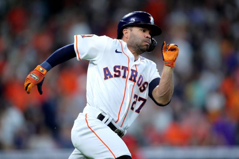 Jul 2, 2022; Houston, Texas, USA; Houston Astros second baseman Jose Altuve (27) runs up the first base line after hitting a double against the Los Angeles Angels during the first inning at Minute Maid Park. Mandatory Credit: Erik Williams-USA TODAY Sports