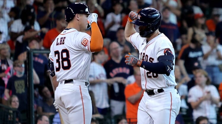 Jul 2, 2022; Houston, Texas, USA; Houston Astros left fielder Chas McCormick (20, right) is congratulated by Houston Astros catcher Korey Lee (38, left) after hitting a home run against the Los Angeles Angels during the seventh inning at Minute Maid Park. Mandatory Credit: Erik Williams-USA TODAY Sports