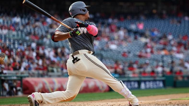 Jul 2, 2022; Washington, District of Columbia, USA; Washington Nationals right fielder Juan Soto (22) hits a home run against the Miami Marlins during the sixth inning at Nationals Park. Mandatory Credit: Scott Taetsch-USA TODAY Sports