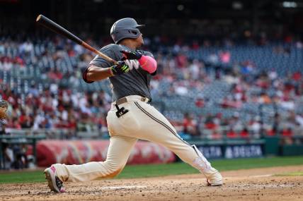 Jul 2, 2022; Washington, District of Columbia, USA; Washington Nationals right fielder Juan Soto (22) hits a home run against the Miami Marlins during the sixth inning at Nationals Park. Mandatory Credit: Scott Taetsch-USA TODAY Sports