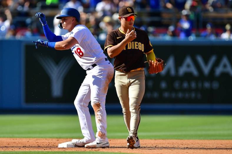 Jul 2, 2022; Los Angeles, California, USA; Los Angeles Dodgers designated hitter Jake Lamb (18) reacts after hitting an RBI double against the San Diego Padres during the third inning at Dodger Stadium. Mandatory Credit: Gary A. Vasquez-USA TODAY Sports