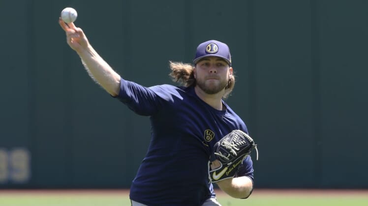 Jul 3, 2022; Pittsburgh, Pennsylvania, USA;  Milwaukee Brewers pitcher Corbin Burnes (39) throws in the outfield before the game against the Pittsburgh Pirates at PNC Park. Mandatory Credit: Charles LeClaire-USA TODAY Sports