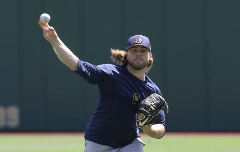 Jul 3, 2022; Pittsburgh, Pennsylvania, USA;  Milwaukee Brewers pitcher Corbin Burnes (39) throws in the outfield before the game against the Pittsburgh Pirates at PNC Park. Mandatory Credit: Charles LeClaire-USA TODAY Sports