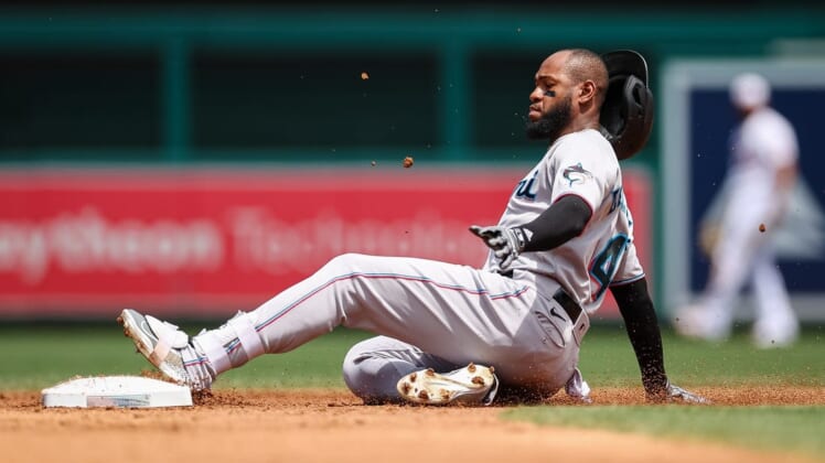 Jul 3, 2022; Washington, District of Columbia, USA; Miami Marlins left fielder Bryan De La Cruz (14) slides safely into second after hitting a double against the Washington Nationals during the third inning at Nationals Park. Mandatory Credit: Scott Taetsch-USA TODAY Sports