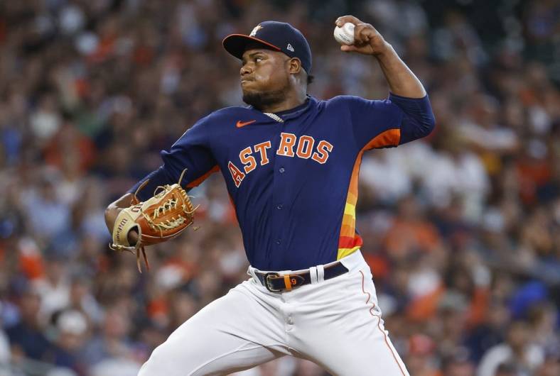 Jul 3, 2022; Houston, Texas, USA; Houston Astros starting pitcher Framber Valdez (59) delivers a pitch during the third inning against the Los Angeles Angels at Minute Maid Park. Mandatory Credit: Troy Taormina-USA TODAY Sports