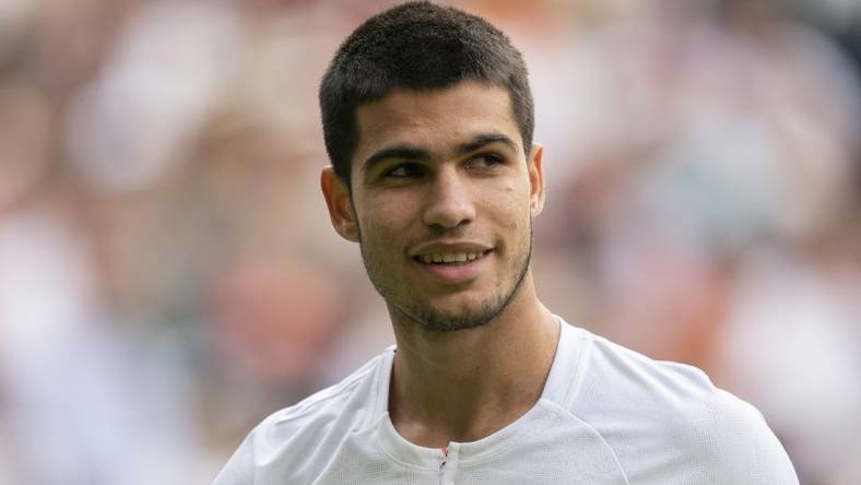 Jul 3, 2022; London, United Kingdom; Carlos Alcaraz (ESP) during his match against Jannik Sinner (ITA) on day seven at All England Lawn Tennis and Croquet Club. Mandatory Credit: Susan Mullane-USA TODAY Sports