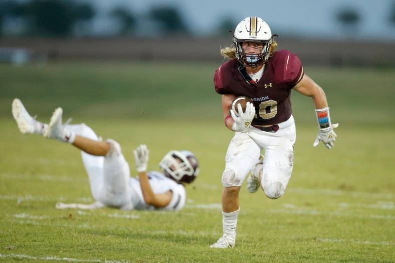 Cashion's Brexten Green carries the ball during a game against Perry on Sept. 4, 2020.