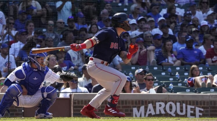 Jul 3, 2022; Chicago, Illinois, USA; Boston Red Sox center fielder Jarren Duran (40) hits a single against the Chicago Cubs during the sixth inning at Wrigley Field. Mandatory Credit: David Banks-USA TODAY Sports
